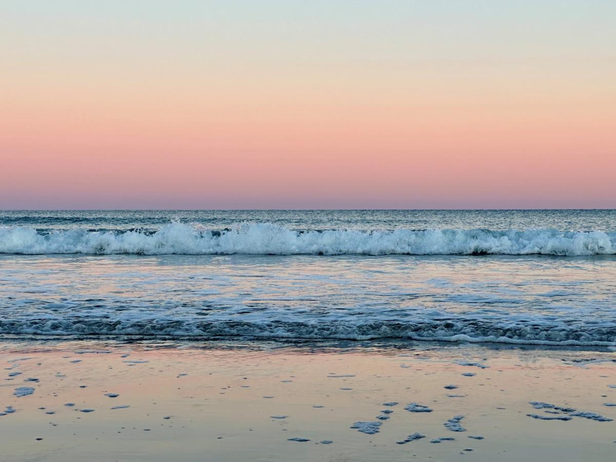 photo of the beach at sunset