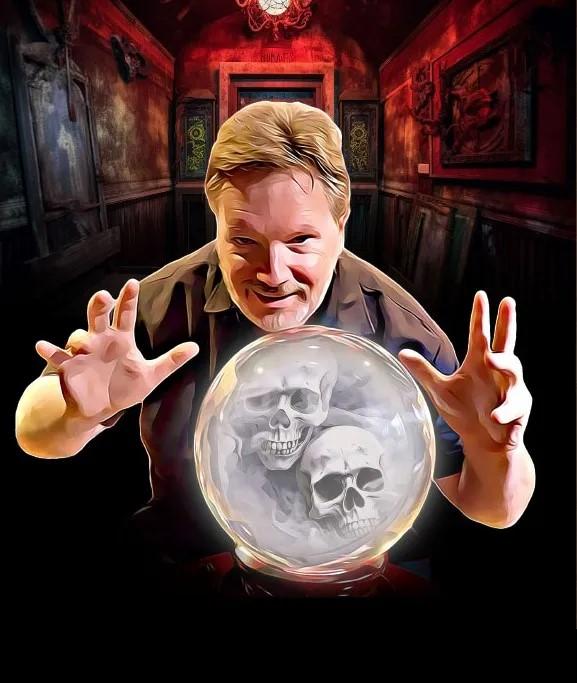 A picture of a man with a crystal ball against a black background